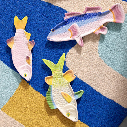 The &Klevering Snapper, Perch and Trigger Fish Plates on a colourful rug