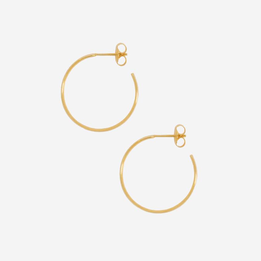 The La Tribe Large Curl Hoops in Gold on a blank background