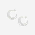 The La Tribe Half Moon Hoops in Silver on a blank background