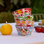 The La La Land Italian Summer Melamine Bowl Set stacked up on a table