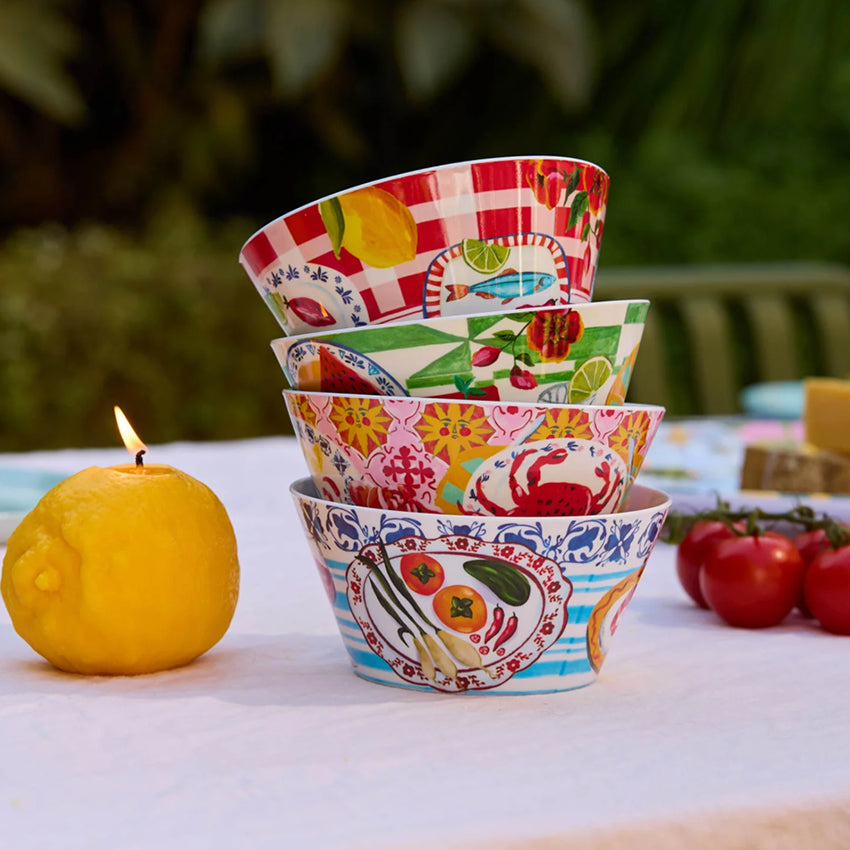 The La La Land Italian Summer Melamine Bowl Set stacked up on a table