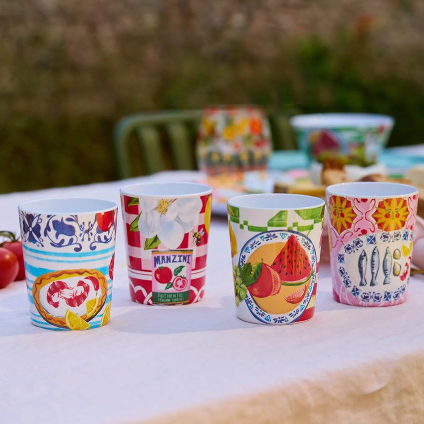 The La La Land Italian Summer Melamine Cup Set on a table setting.