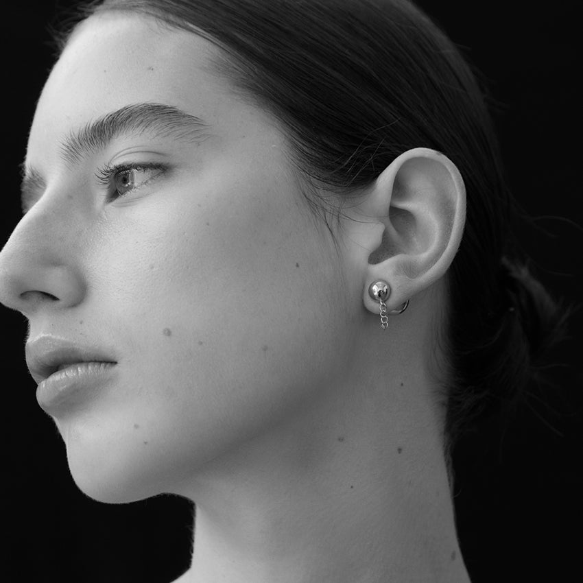 The La Tribe Ball and Chain Studs on a model in Black & White