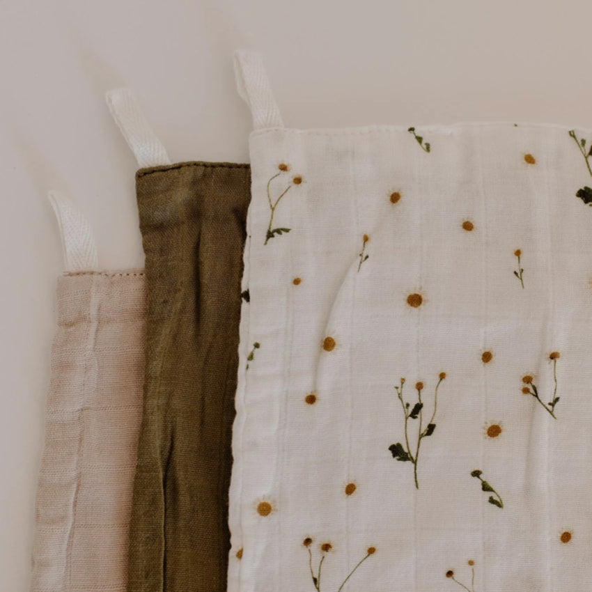 A closeup of the Leni The Label Muslin Cloth Set of 3 in Daisy