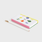 The Lettuce Fruit Notes Notebook on a blank background next to a pencil