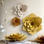 The Lovi 3D Flower Decor in Cinnamon hanging on a wall with other coloured Lovi 3D Flowers