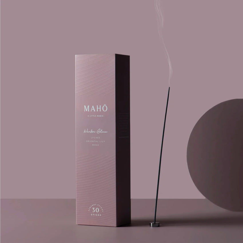 The Maho Wander Bloom Sensory Sticks on a purple background