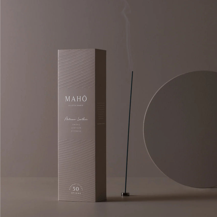The Maho Artisan Leather Sensory Sticks on a brown background