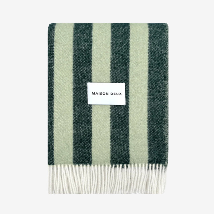 Striped Candy Wrap Blanket in green sage pattern and 'MAISON DEUX' label on a white background