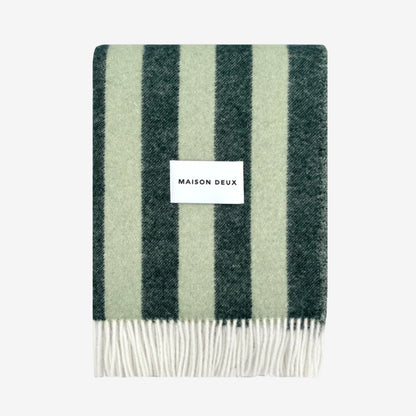 Striped Candy Wrap Blanket in green sage pattern and 'MAISON DEUX' label on a white background