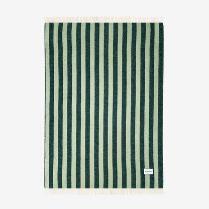 The Maison Deux Candy Wrap Blanket in green sage vertical stripes on a white background
