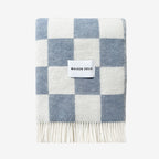 Checkerboard blanket in Denim with 'Maison Deux' label on a white background