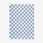 Maison Deux Checkerboard blanket in Denim on a blank background