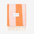 Rough Stripe Blanket in pink and orange blanket with 'MAISON DEUX' label on a white background