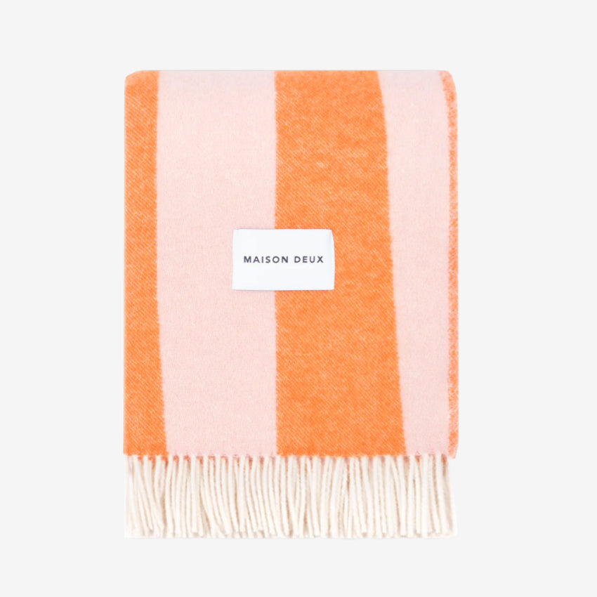 Rough Stripe Blanket in pink and orange blanket with 'MAISON DEUX' label on a white background