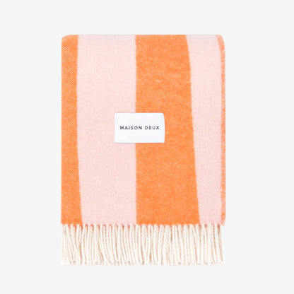 Rough Stripe Blanket in pink and orange blanket with 'MAISON DEUX' label on a white background