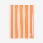 Maison Deux Rough Stripe Blanket in pink and orange on a blank background