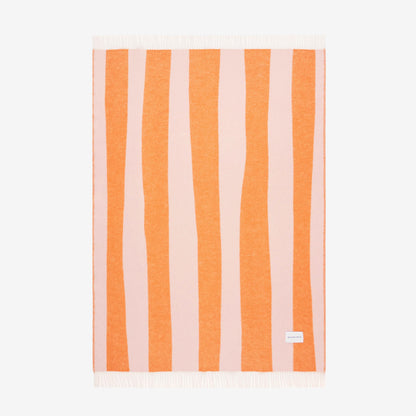 Maison Deux Rough Stripe Blanket in pink and orange on a blank background