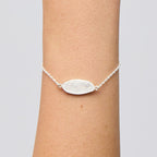 The Meadowlark Blessed Bracelet in Sterling Silver on a models wrist