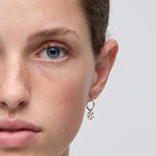 The Meadowlark Posie Signature Hoops in Sterling Silver on a model