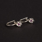 The Meadowlark Posie Signature Hoops in Sterling Silver on black felt
