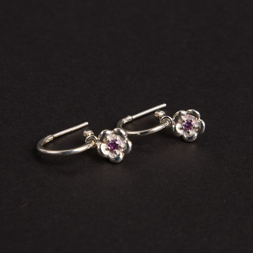 The Meadowlark Posie Signature Hoops in Sterling Silver on black felt