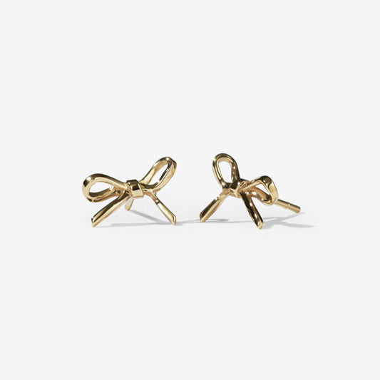 The Meadowlark Bow Stud Earrings in Gold Plated on a blank background