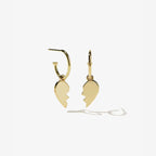 The Meadowlark Broken Heart Signature Hoops in Gold Plated on a blank background