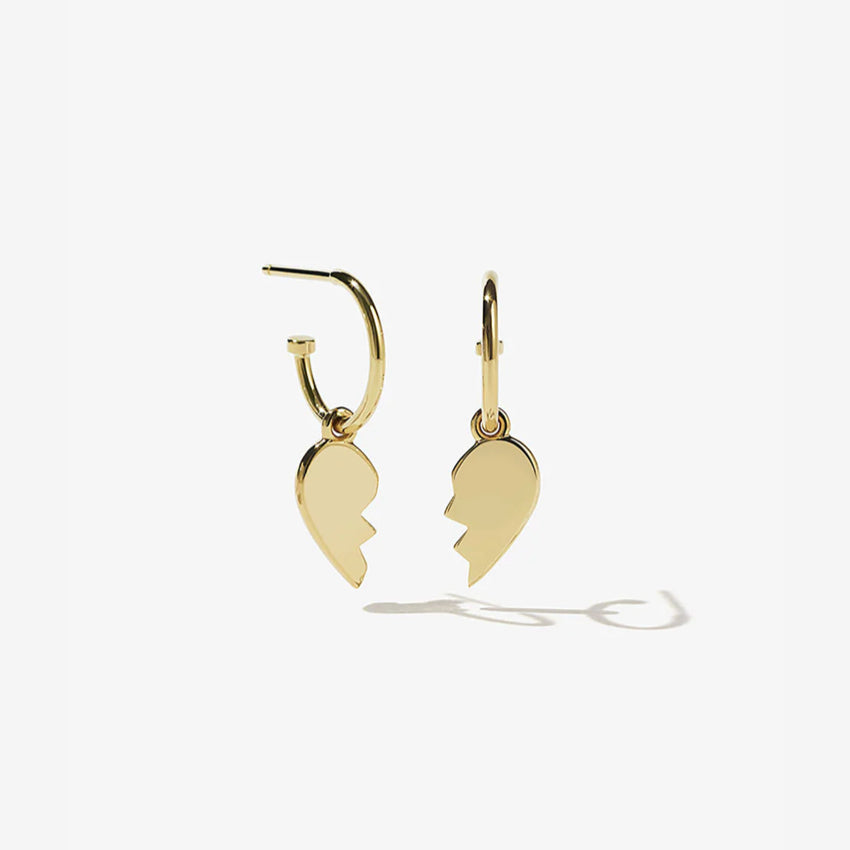 The Meadowlark Broken Heart Signature Hoops in Gold Plated on a blank background