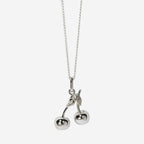 The Meadowlark Cherry Charm Necklace on a 50cm chain in silver on a blank background