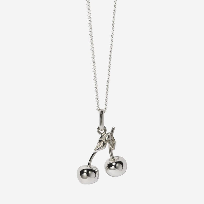 The Meadowlark Cherry Charm Necklace on a 50cm chain in silver on a blank background
