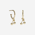 The Meadowlark Cherry Signature Hoops in Gold on a blank background