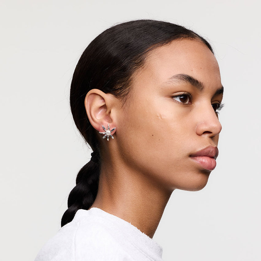 The Meadowlark Daisy Earrings in Medium and Sterling Silver on a model