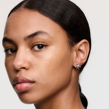 The Meadowlark Daisy Studs in Sterling Silver on a model