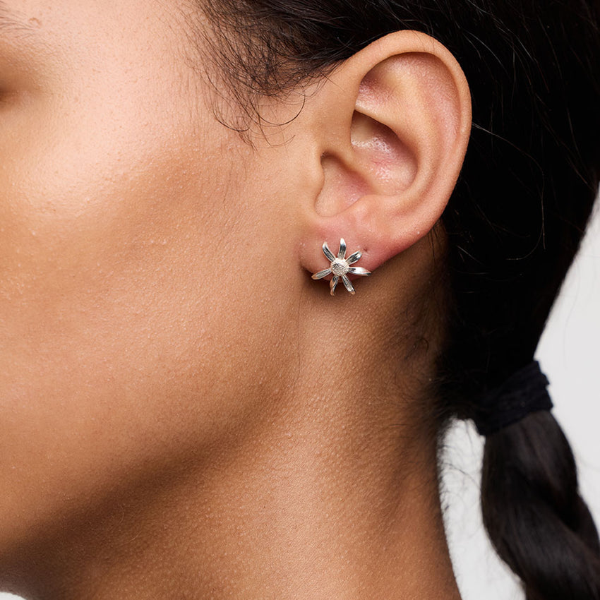 The Meadowlark Daisy Studs in Sterling Silver on a model