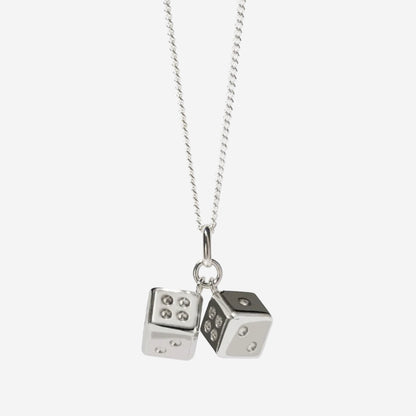 The Meadowlark Dice Charm Necklace in silver on a blank background