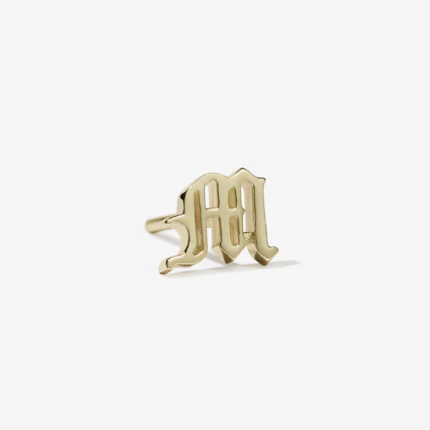 Meadowlark M Letter Stud in gold on a blank background