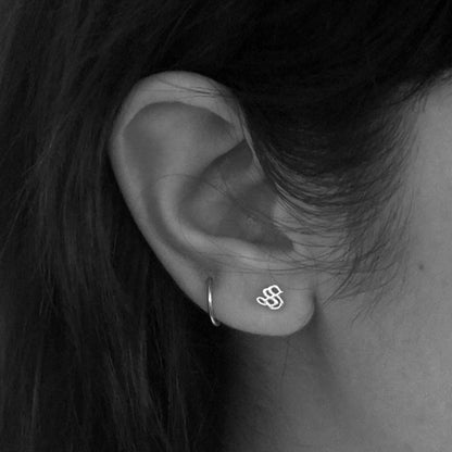 Meadowlark M Letter Stud in Sterling Silver on a model