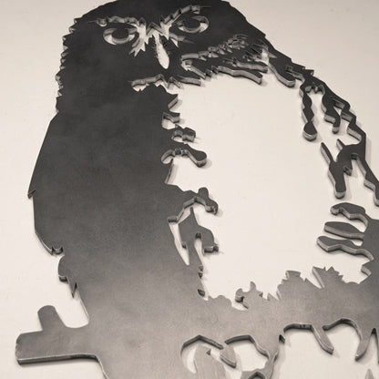 A closeup of the Metalbird Ruru garden sculpture on a blank background