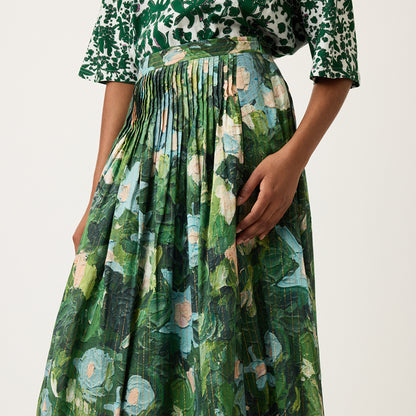 A close up of the Nancybird Alma Yoke Skirt in Garden Print on a model