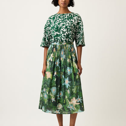 The Nancybird Alma Yoke Skirt in Garden Print on a model on a grey background