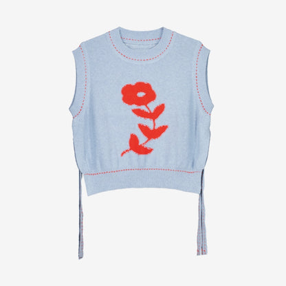 The Nancybird Aria Vest in Flower on a grey background