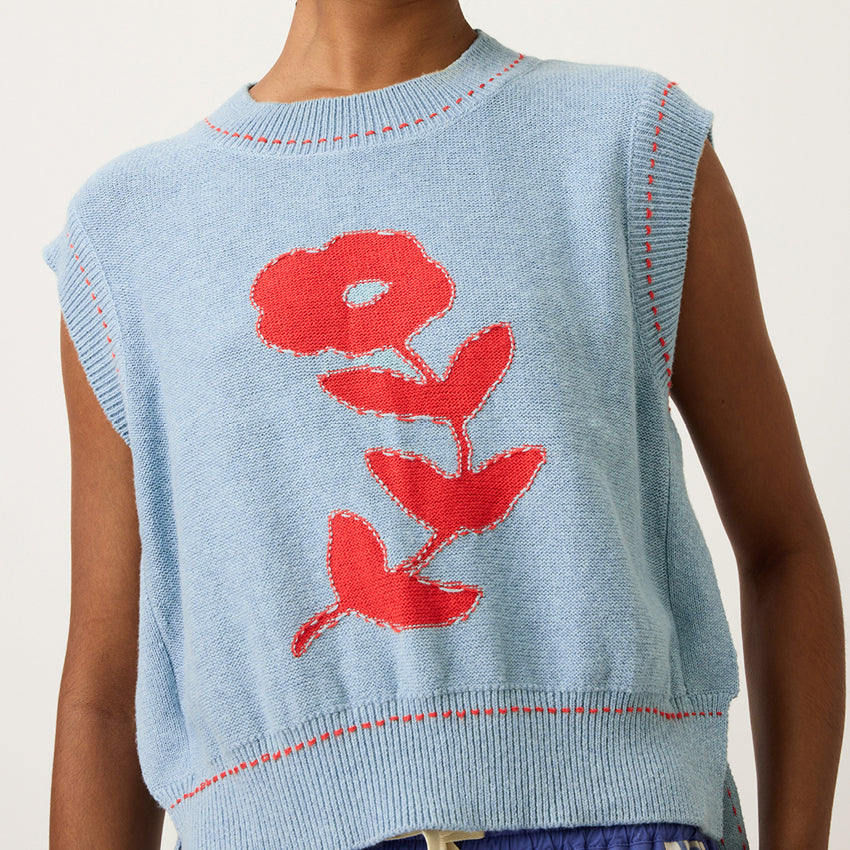 A close up of the Nancybird Aria Vest in Flower on a model