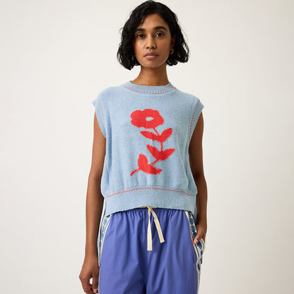 The Nancybird Aria Vest in Flower on a model on a grey background