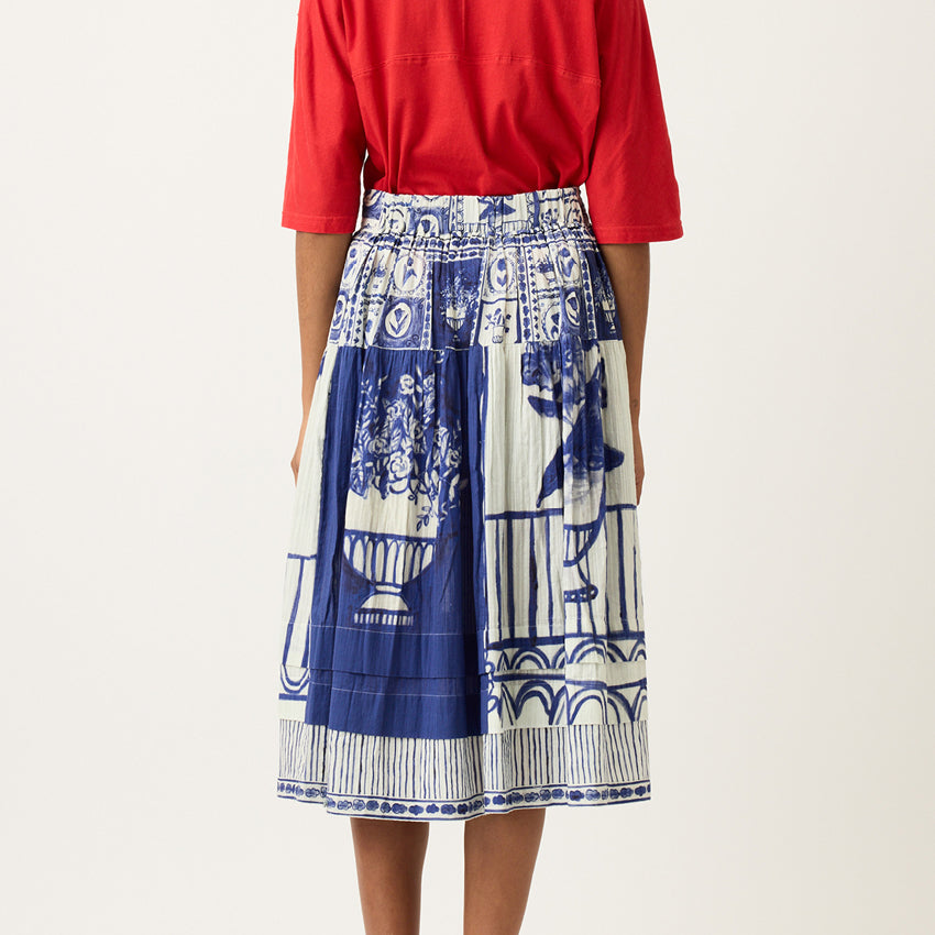 A back view of the Nancybird Coco Pintuck Skirt in Lyon Tile on a model