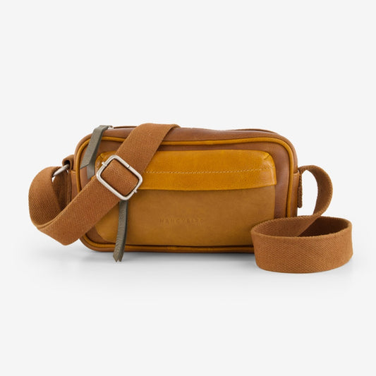 The Nancybird Goshen Bag in Tan on a grey background