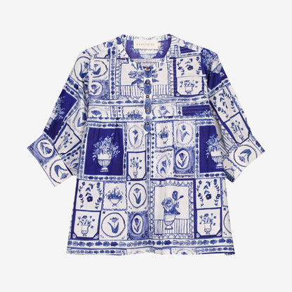 The Nancybird Gwen Blouse in Lyon Tile on a grey background