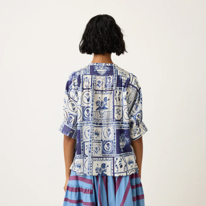 A back view of the Nancybird Gwen Blouse in Lyon Tile on a model