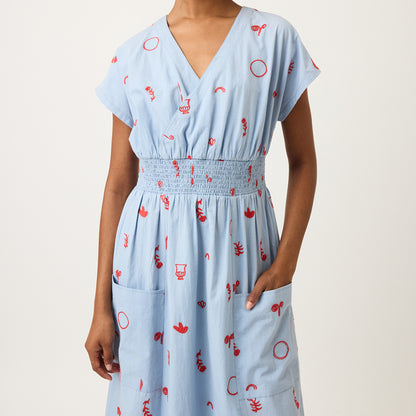 A closeup of the Nancybird Hana Dress in Motif Embroidery on a model