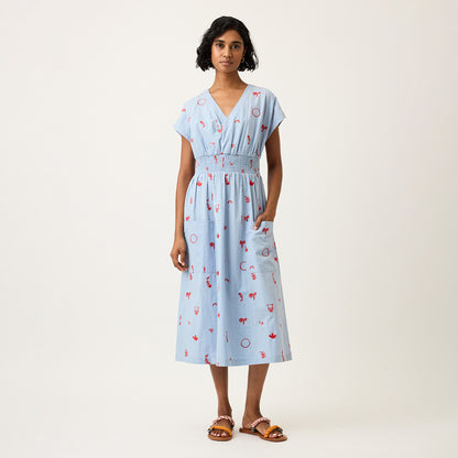 The Nancybird Hana Dress in Motif Embroidery on a model paired with sandals